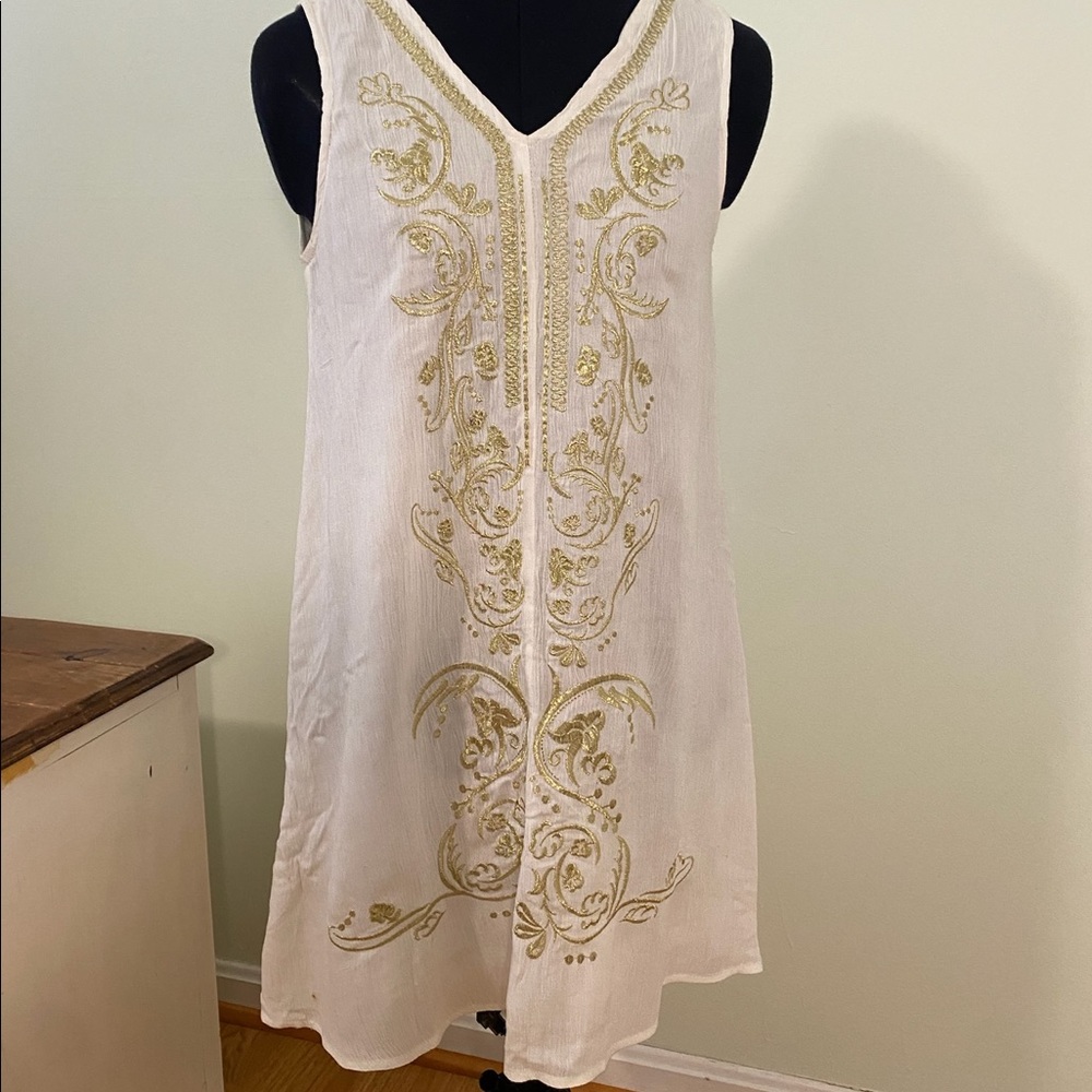 White dress with gold embroidery